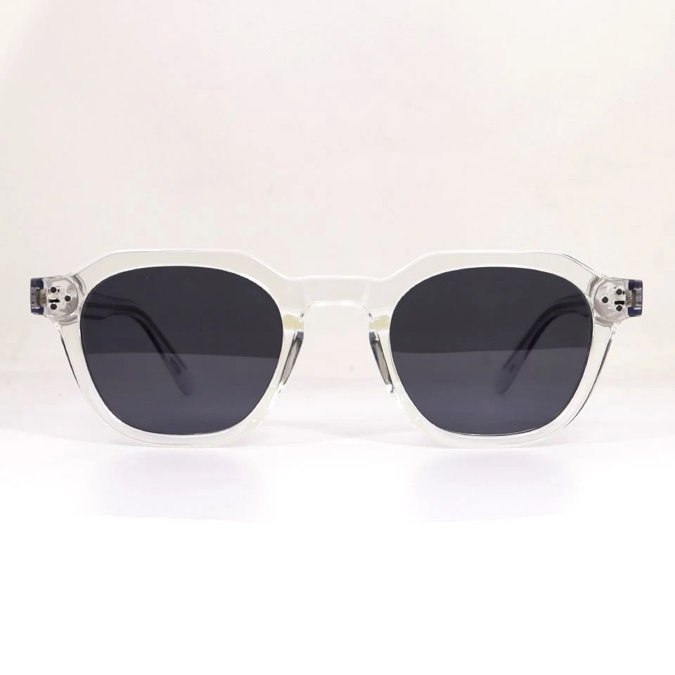 Transparent acetate sunglasses front view showing rim structure and dark polarized lenses